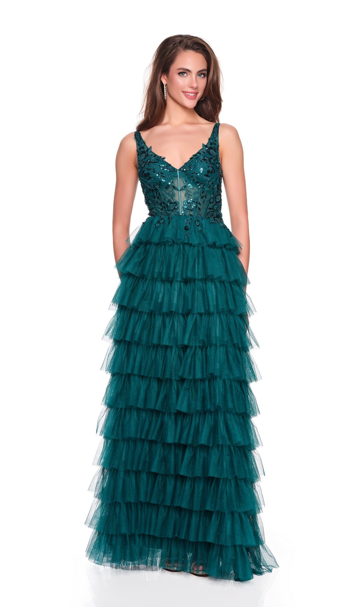 A woman models the Dave and Johnny 12635 long prom dress, featuring a sleeveless embroidered bodice and tiered tulle skirt, posed against a plain white background.
